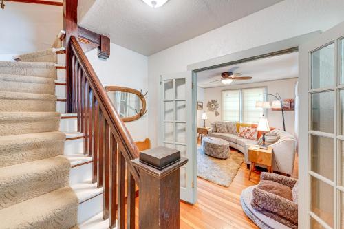 a living room with a staircase and a living room at Lake Geneva Family Gem with Fenced Dog Run! in Lake Geneva