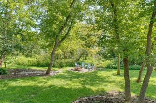 two chairs in a park with trees and grass at Lake Geneva Family Gem with Fenced Dog Run! in Lake Geneva