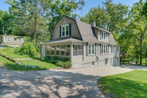 a house with a gambrel roof and a driveway at Lake Geneva Family Gem with Fenced Dog Run! in Lake Geneva