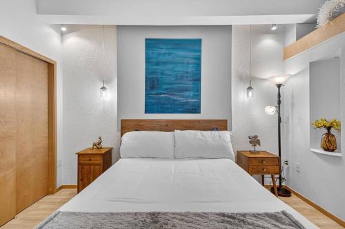 a bedroom with a large white bed in it at 302A Village View | European Village in Bon Terra