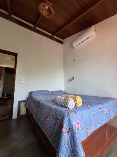 Ένα ή περισσότερα κρεβάτια σε δωμάτιο στο Quartos no Caribe Amazônico com vista para a Praia do Amor