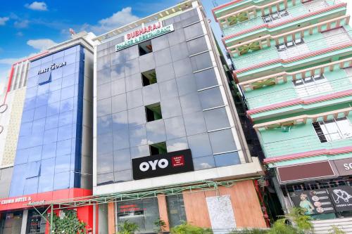 an office building with an ovs sign on it at Hotel O subharaj palace and restaurant in Kalyani