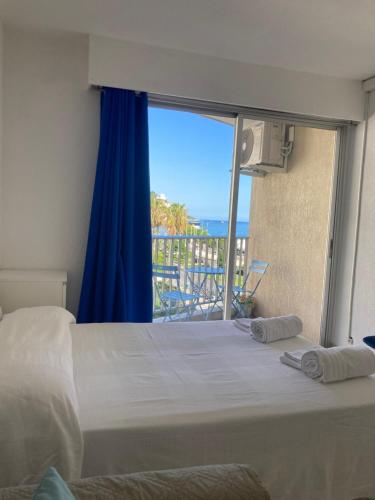 Ένα ή περισσότερα κρεβάτια σε δωμάτιο στο Studio La Cigale vue Mer