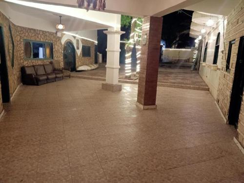 a lobby with a couch and a table in a building at فندق جرين فالي دهب - Green Valley Hotel in Dahab