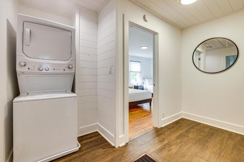 a room with a washer and dryer and a mirror at Families Welcome, Fenced Yard Inviting Greer Home in Greer