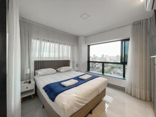 En eller flere senge i et værelse på Alto Luxo e uma Bela Vista no Edifício Vertigo