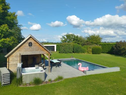 a swimming pool with a pink flamingo in a yard at Il Giardino Segreto in Waterloo