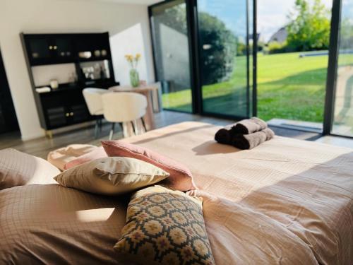 a bedroom with two beds and a large window at Il Giardino Segreto in Waterloo