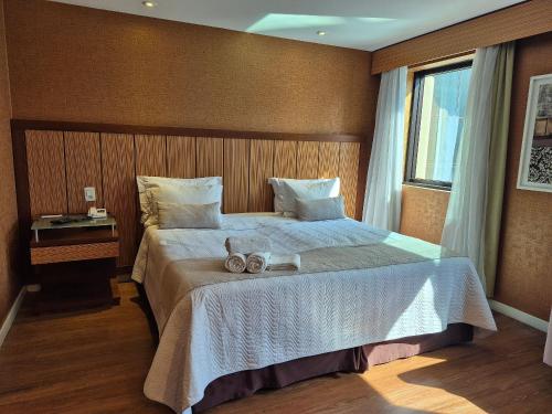 Postel nebo postele na pokoji v ubytování Flat Hotel Ibirapuera Moema Apto 127A