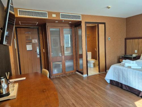 Postel nebo postele na pokoji v ubytování Flat Hotel Ibirapuera Moema Apto 127A