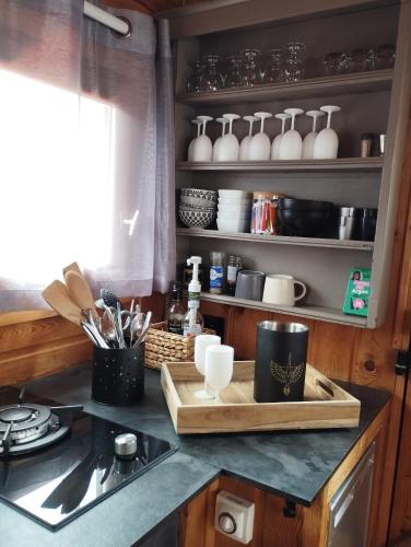 a kitchen with a counter top with a cutting board at La Toue Charme in Angers