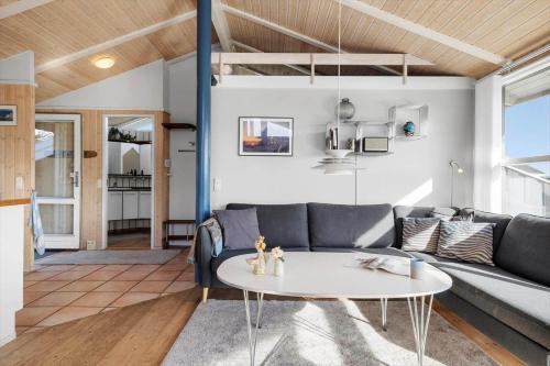 a living room with a couch and a table at LN1822-Hjorring-Hojlandet-21 in Hjørring