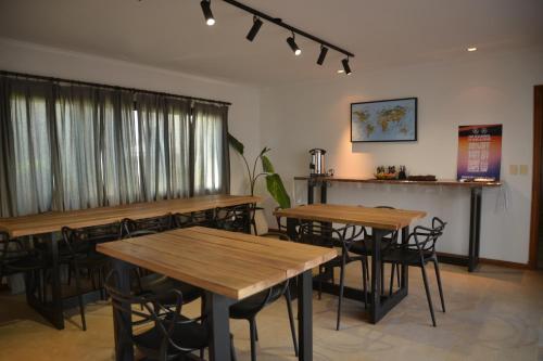 a dining room with wooden tables and chairs at Beach House AP in Miramar