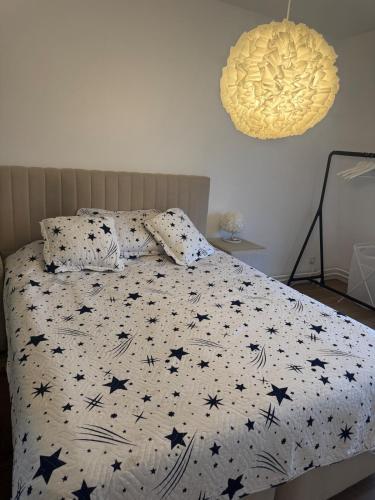 a bedroom with a bed with stars on it at Luxurious apartment in Auderghem in Brussels