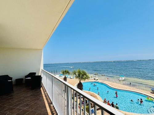 a view of the beach from the balcony of a resort at Ocean Serenity in Pensacola