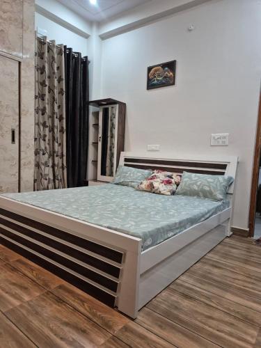 a bedroom with a large bed in a room at The classy'O Inn in Lucknow