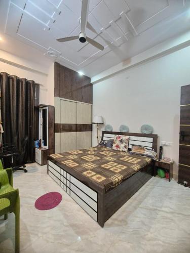 a bedroom with a large bed in a room at The classy'O Inn in Lucknow