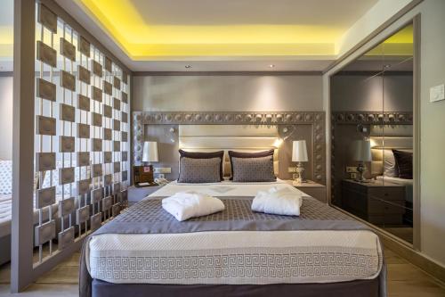 a bedroom with a large bed with two pillows at VONRESORT Elite & Aqua - Ultra All Inclusive & Kids Concept in Side