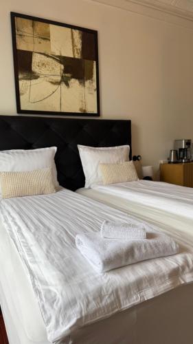 a bedroom with two beds with towels on them at City Guesthouse in Reykjavík