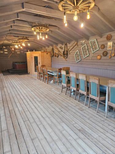 a dining room with a table and chairs at Cabana Vikingilor Bucovina in Vama