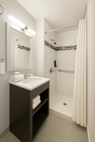 a bathroom with a sink and a shower at Heritage Hotel New York City in New York