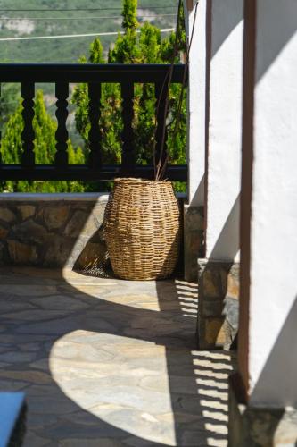 a wicker basket sitting on the side of a balcony at Villa Tethys Mountain Resort in Zákas