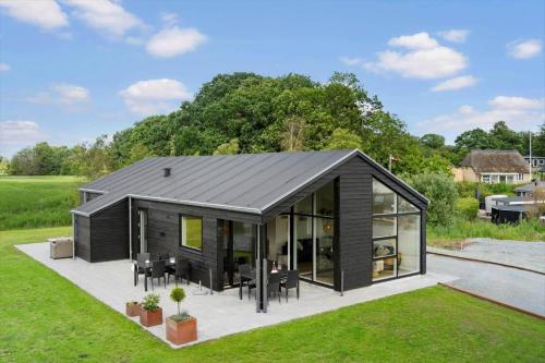 a black modular house with a lot of windows at SJ256-Haderslev-Sonderballe-Strand-83-A in Haderslev