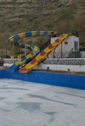 a water slide in a swimming pool at Holiday Home Agro Tourism 