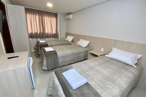 Postel nebo postele na pokoji v ubytování Edifício Shalfa