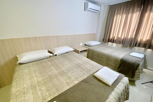 Postel nebo postele na pokoji v ubytování Edifício Shalfa