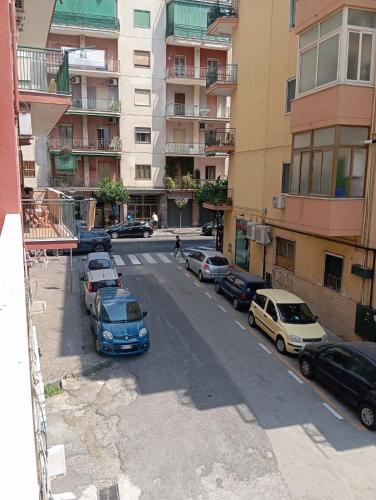 a view of a street with parked cars and buildings at Regency House Accoglienza in Portici