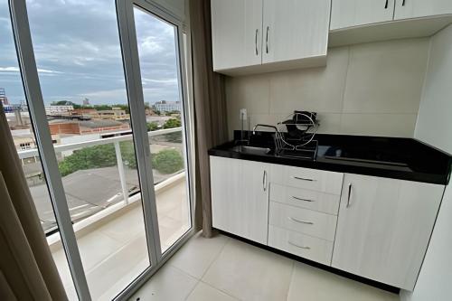 Kuchyň nebo kuchyňský kout v ubytování Edifício Shalfa