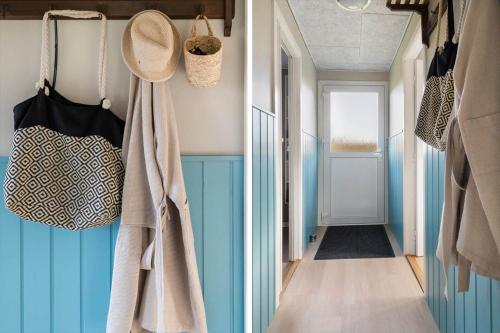 a hallway with blue and white walls at SJ277-Haderslev-Kelstrup-Norreskov-36 in Haderslev