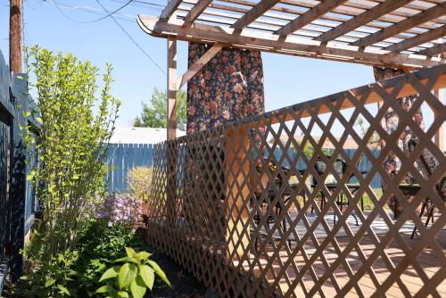 a wooden fence with a wooden pergola at Central Richland 3 bedroom in Richland