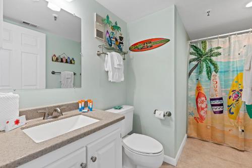 a bathroom with a sink and a toilet and a shower at Oceanfront Condo at Oceania Beach Club - Pool, Balcony, Sleeps 6, Walk to Flagler Ave! in Chicken Island