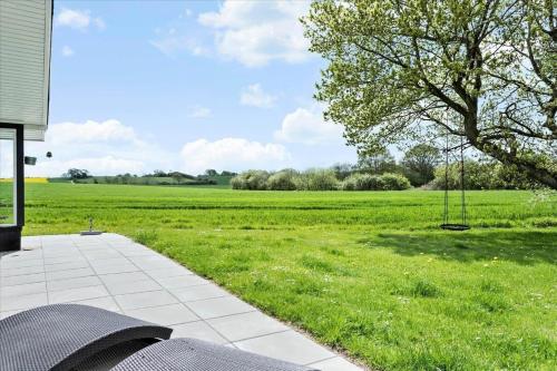 a view of a grassy field with a swing at SJ253-Haderslev-Vikaerparken-89 in Haderslev