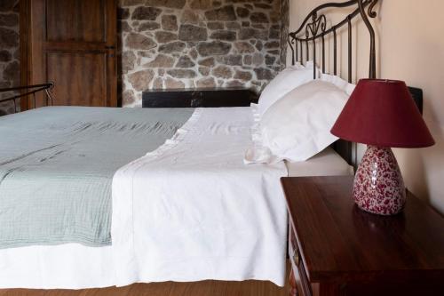 Ένα ή περισσότερα κρεβάτια σε δωμάτιο στο Casa Marù