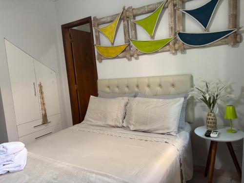 Ένα ή περισσότερα κρεβάτια σε δωμάτιο στο Loft 109- Espaço Praia Aptos