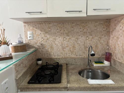 Η κουζίνα ή μικρή κουζίνα στο Loft 109- Espaço Praia Aptos