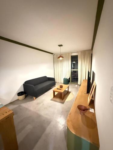 a living room with a couch and a table at Noemí Apartment in Oaxaca City