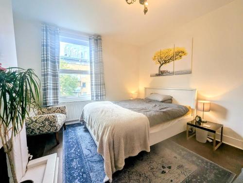 Ένα ή περισσότερα κρεβάτια σε δωμάτιο στο TopHome Arsenal