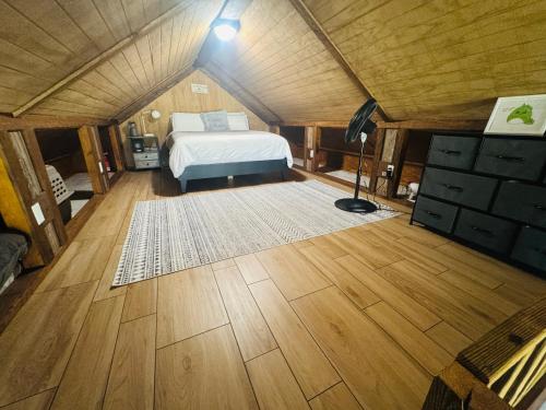 a bedroom with a bed in a small room at Lucky Lodge ViP Cabin Lake Guntersville Pet Friendly Fully Fenced Boat Parking Private in Guntersville
