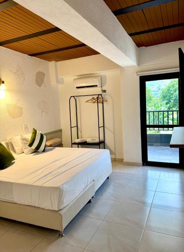Ένα ή περισσότερα κρεβάτια σε δωμάτιο στο Ivanna Hotel Campestre - Santa Fe de Antioquia