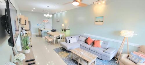 a living room with a couch and a table at La Isla F102 condo in South Padre Island
