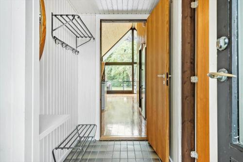 a hallway with a door and a tile floor at LL238-Tranekaer-Engvej-17 in Tranekær