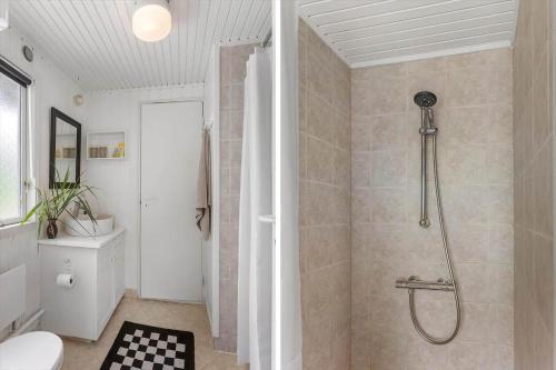 a bathroom with a shower and a toilet at LL252-Humble-Laxtonvej-36 in Humble