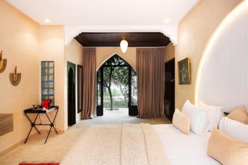 Ένα ή περισσότερα κρεβάτια σε δωμάτιο στο PL Place boutique hôtel & restaurant