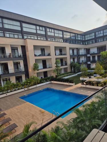 an image of an apartment building with a swimming pool at Comfortable home GH in Accra