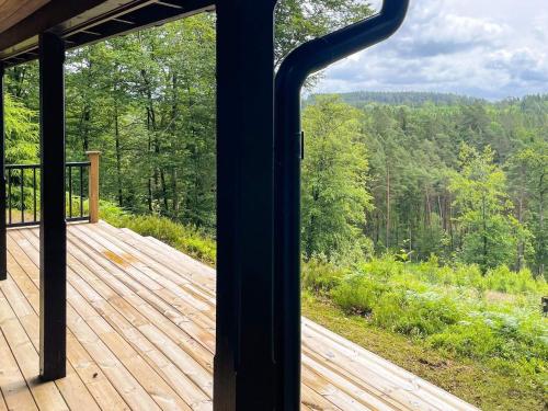 a view of a deck from a screened in porch at 6 person holiday home in KNÄRED in Knäred