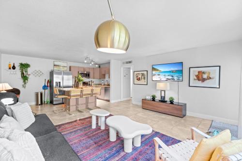 a living room with a couch and a table at The Olives at Prospect Park in West Palm Beach